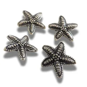Set of 4 starfish-shaped buttons