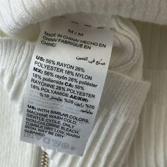 WHBM white turtleneck textured sweater with gold zipper detail on sleeves