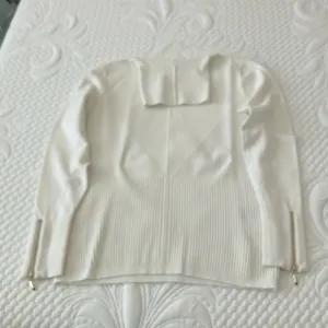 WHBM white turtleneck textured sweater with gold zipper detail on sleeves